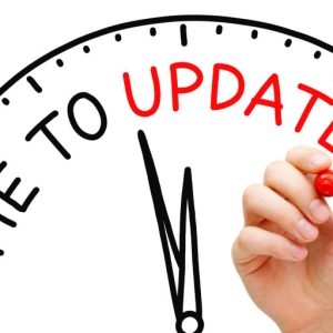 27698478 - hand writing time to update concept with red marker on transparent wipe board.